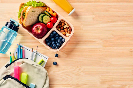 Healthy school lunch with whole grains, fruits, vegetables, and water for kids’ brain health